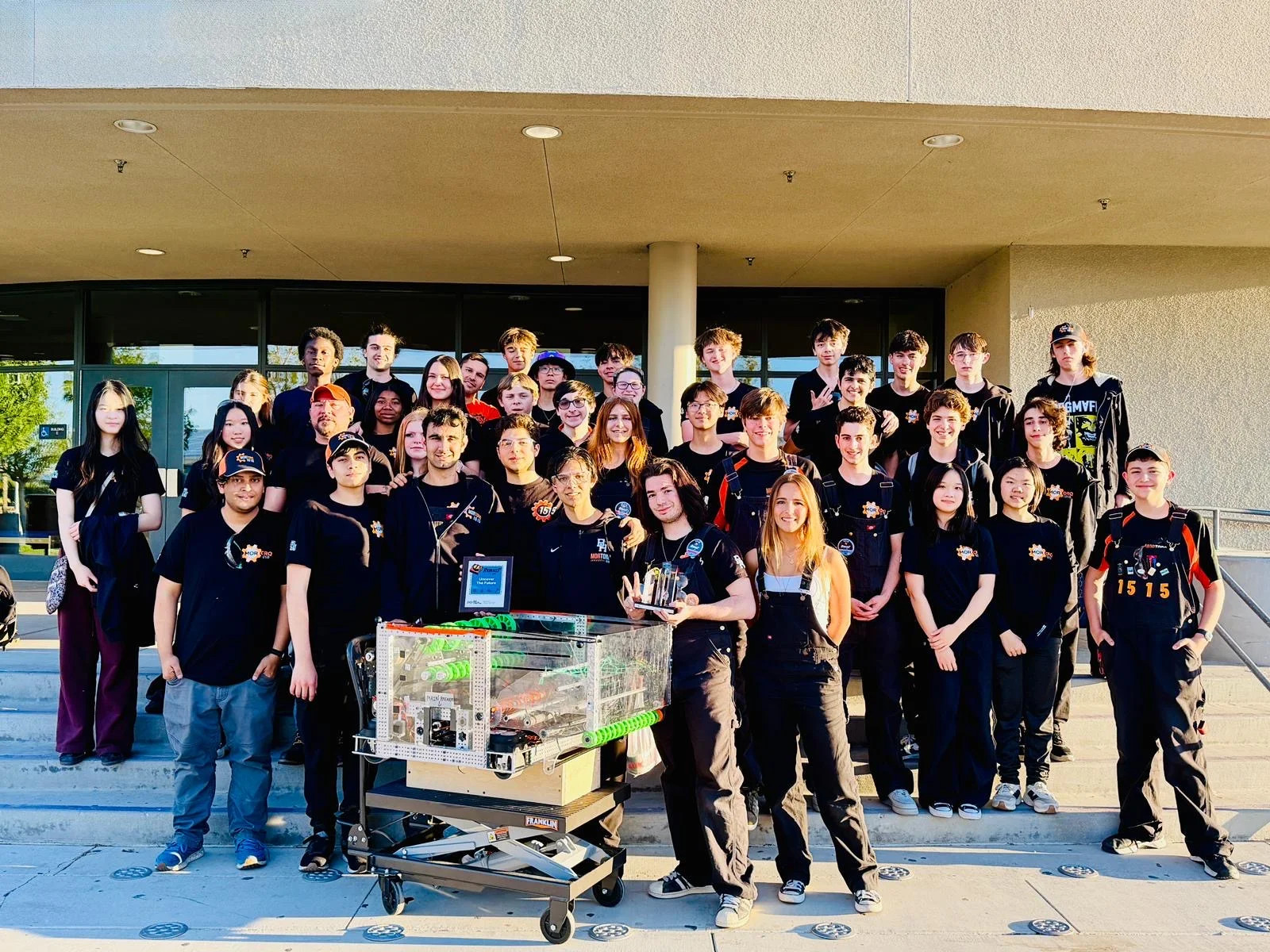 MorTorq students, mentors, and the 2026 robot together after the Aerospace Valley event